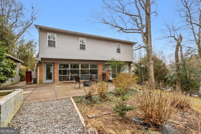 rear view of house featuring a patio area