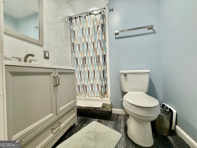 bathroom with vanity, a shower with curtain, toilet, and hardwood / wood-style flooring