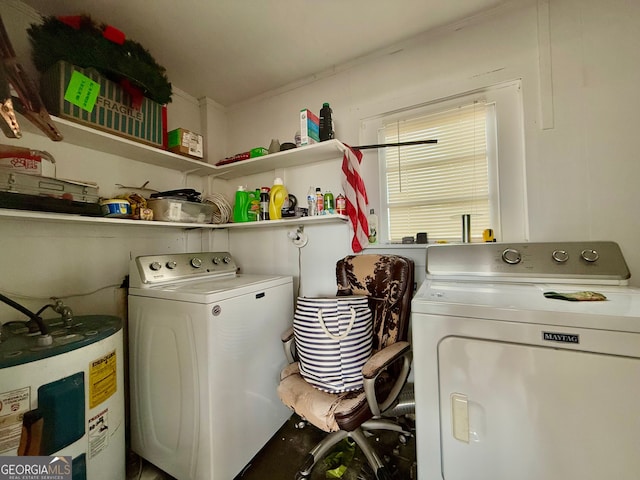 laundry area with water heater and washing machine and dryer