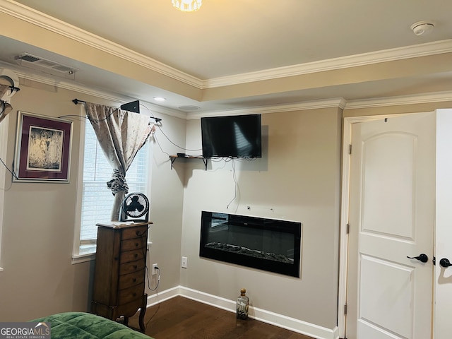 bedroom featuring crown molding and dark hardwood / wood-style floors