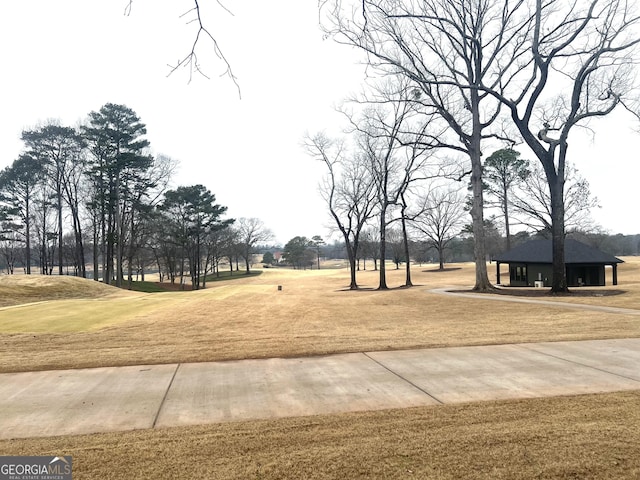 view of property's community with a lawn