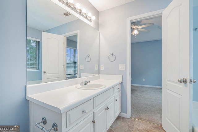 bathroom featuring ceiling fan and vanity