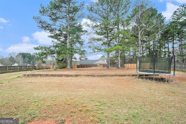 view of yard with a trampoline