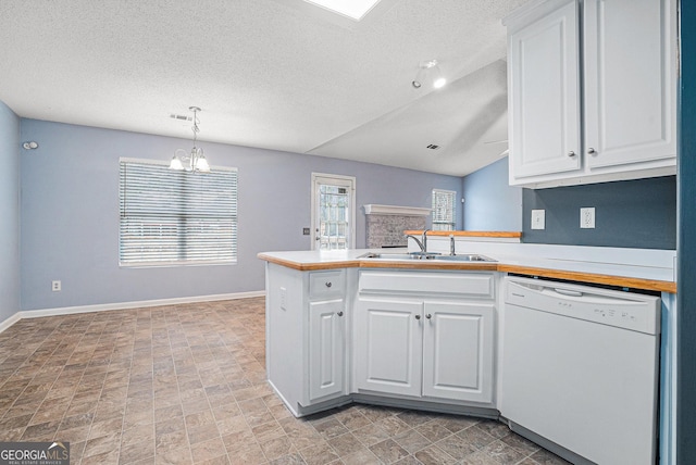 kitchen with dishwasher, sink, and white cabinets