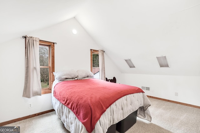 carpeted bedroom with vaulted ceiling