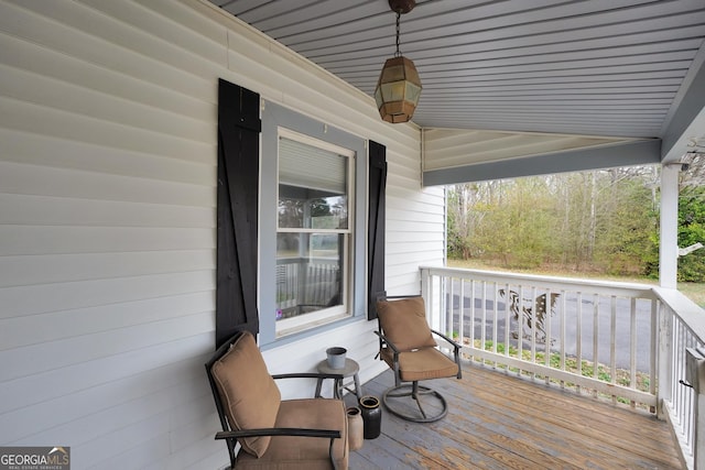 wooden deck featuring covered porch