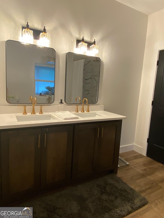 bathroom featuring hardwood / wood-style flooring and vanity