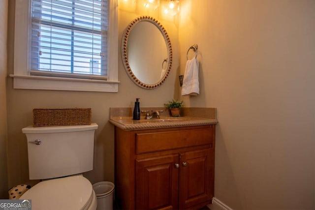 bathroom featuring vanity and toilet