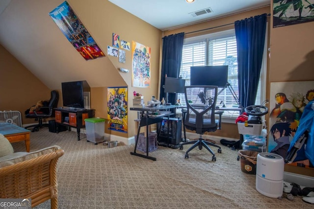 carpeted office featuring vaulted ceiling