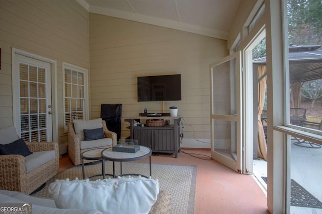 sunroom featuring lofted ceiling