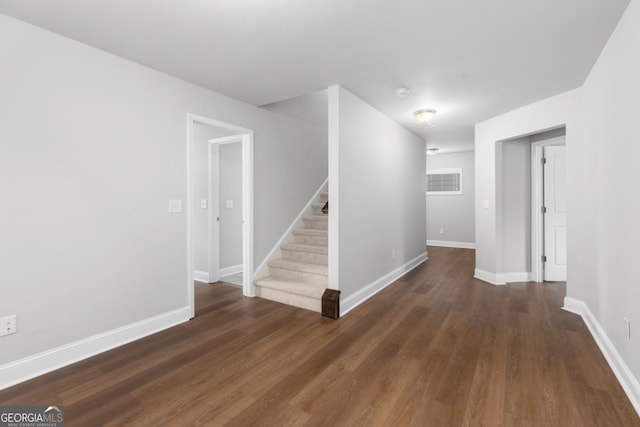 hall featuring dark wood-type flooring