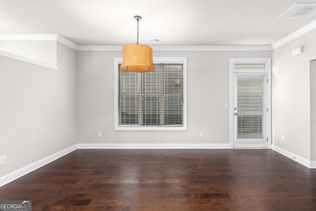 unfurnished dining area with ornamental molding and dark hardwood / wood-style floors