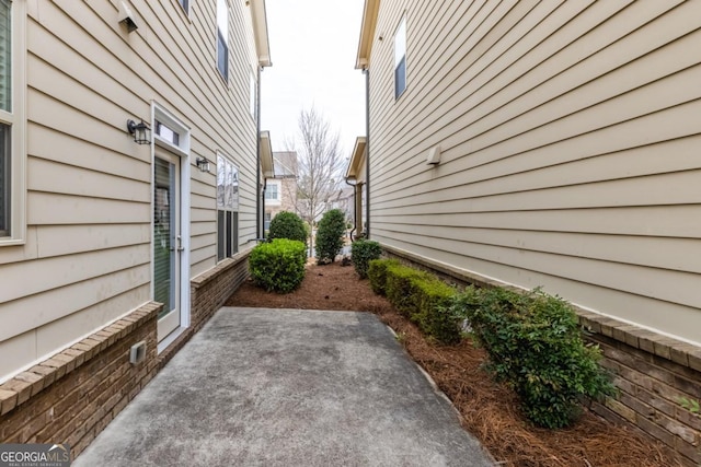 view of side of home with a patio