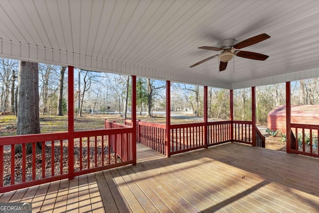 wooden terrace featuring ceiling fan