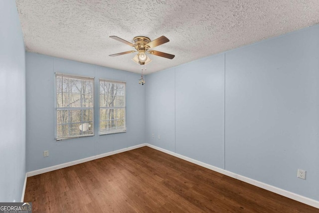 spare room with ceiling fan, hardwood / wood-style floors, and a textured ceiling