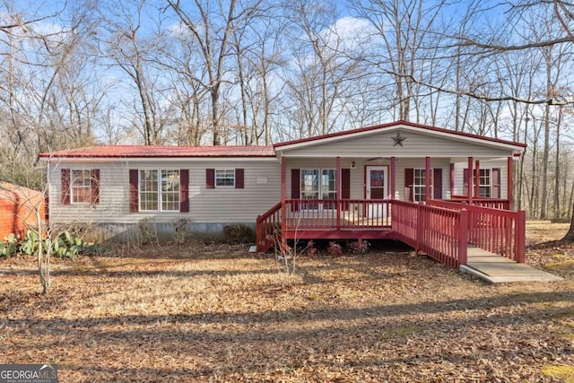 manufactured / mobile home featuring covered porch