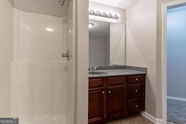 bathroom with vanity and a shower