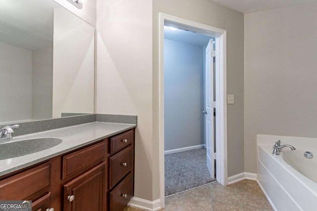 bathroom featuring vanity and a bathing tub