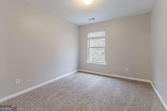 unfurnished room featuring carpet flooring