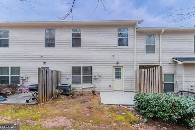 back of property featuring cooling unit and a patio area