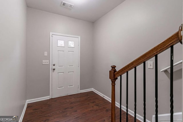 foyer entrance featuring dark hardwood / wood-style floors