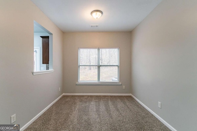 empty room featuring carpet flooring