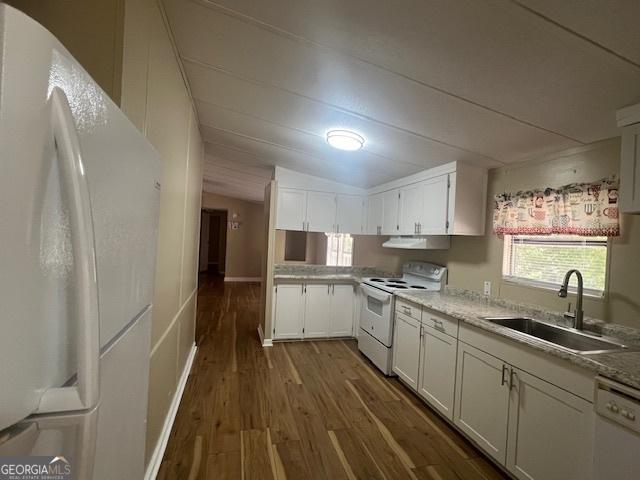 kitchen featuring sink, white appliances, light stone countertops, white cabinets, and dark hardwood / wood-style flooring