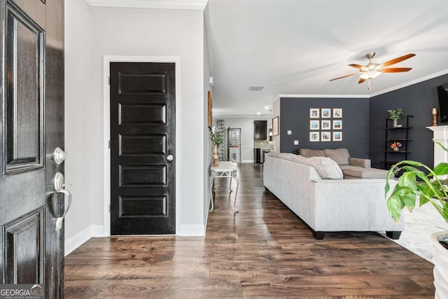 living room featuring ornamental molding, dark hardwood / wood-style floors, and ceiling fan