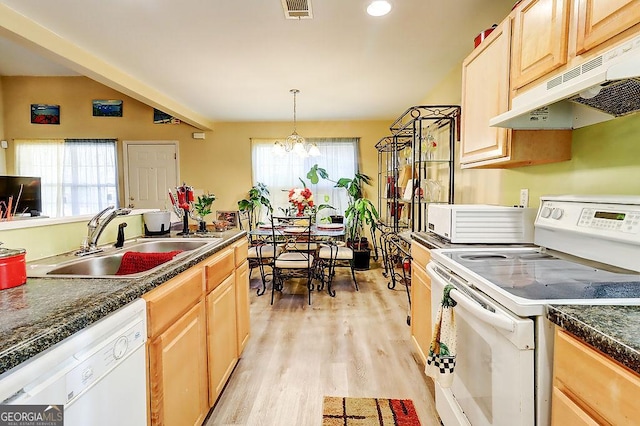 kitchen with sink, light brown cabinets, white appliances, and decorative light fixtures