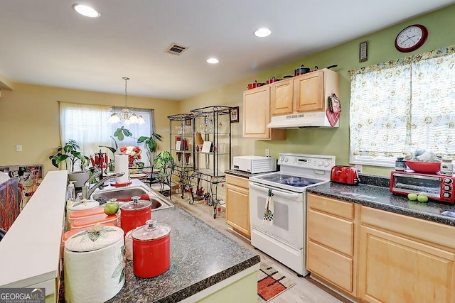 kitchen featuring light brown cabinetry, sink, decorative light fixtures, electric range, and a notable chandelier