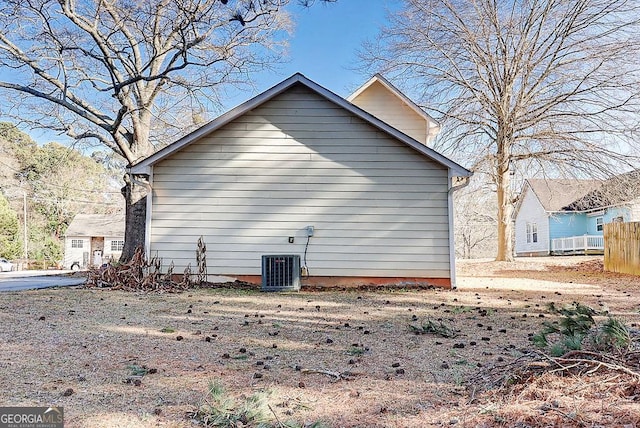 view of home's exterior with cooling unit