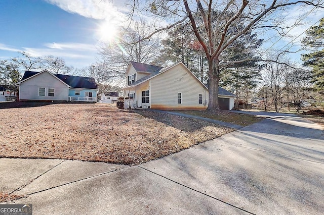 view of side of home featuring a garage