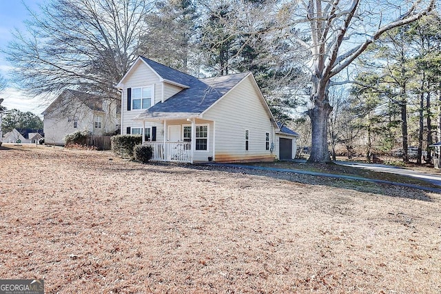 exterior space with a garage and a porch