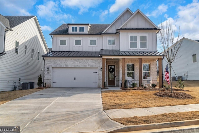 modern inspired farmhouse with a porch, a standing seam roof, brick siding, and board and batten siding