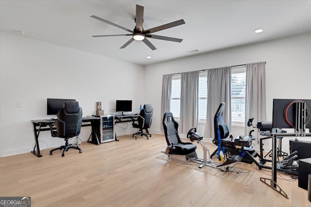 office space with light hardwood / wood-style flooring and ceiling fan