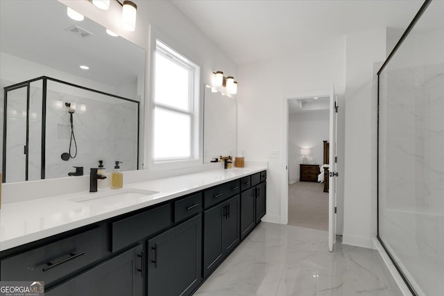 bathroom with an enclosed shower and vanity