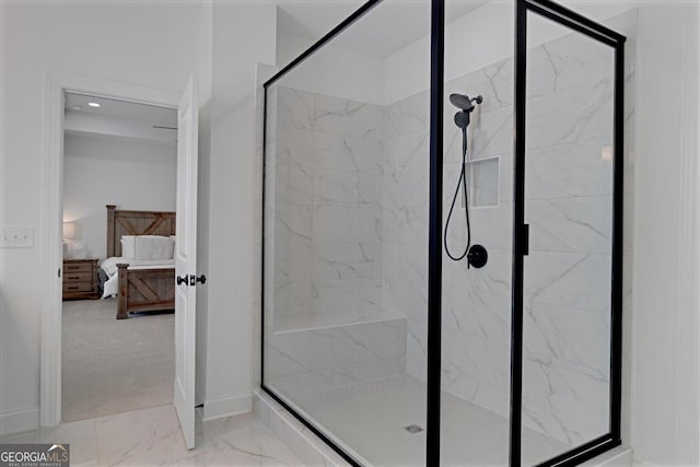 bathroom featuring a shower with door