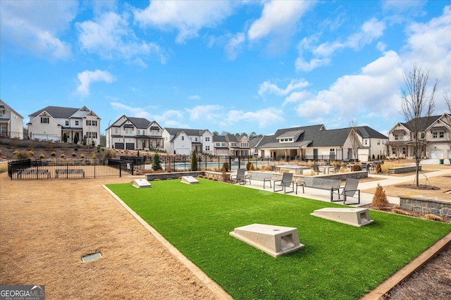 view of home's community featuring a yard