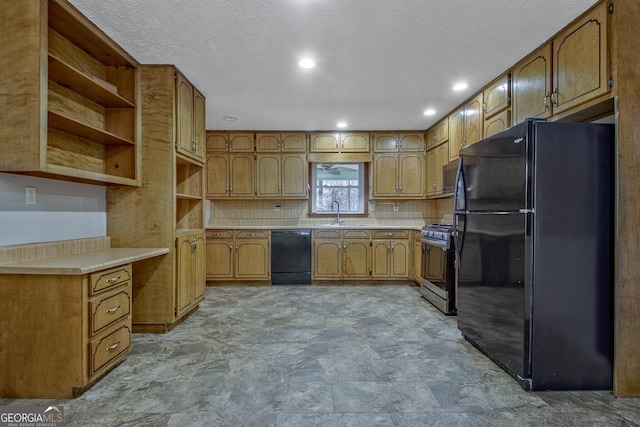 kitchen featuring tasteful backsplash, sink, a textured ceiling, and black appliances