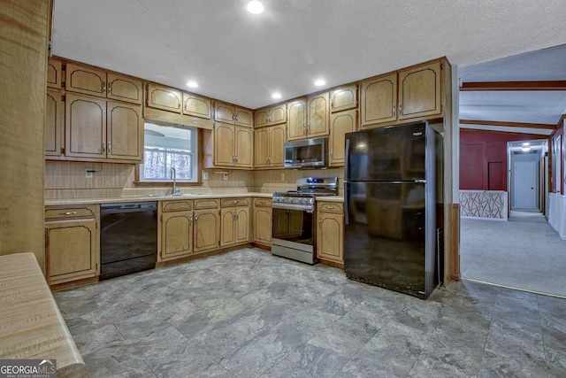 kitchen with sink, decorative backsplash, black appliances, and a textured ceiling