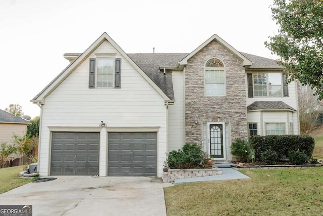 view of front facade with a garage and a front yard