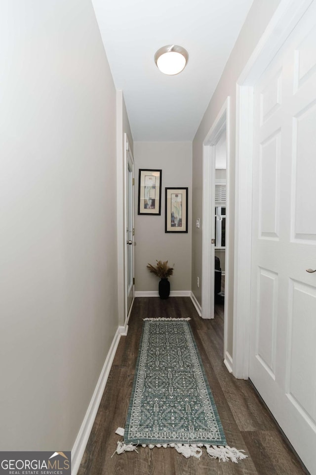 corridor with dark wood-type flooring