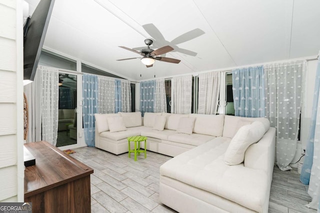 living room with vaulted ceiling and ceiling fan