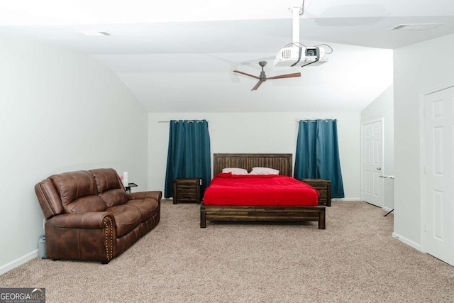 carpeted bedroom with vaulted ceiling