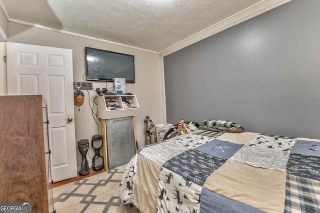 bedroom featuring crown molding and a textured ceiling