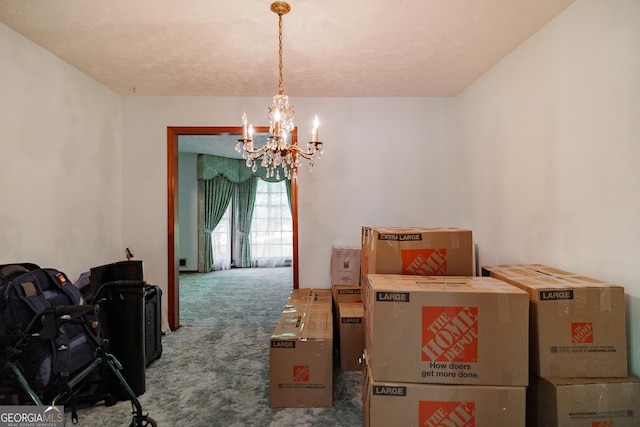 dining space with carpet flooring and a chandelier