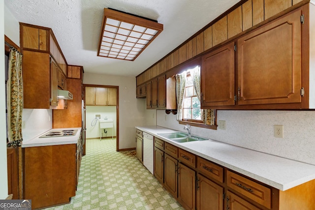 kitchen featuring tasteful backsplash, sink, and white appliances