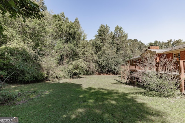 view of yard with a wooden deck