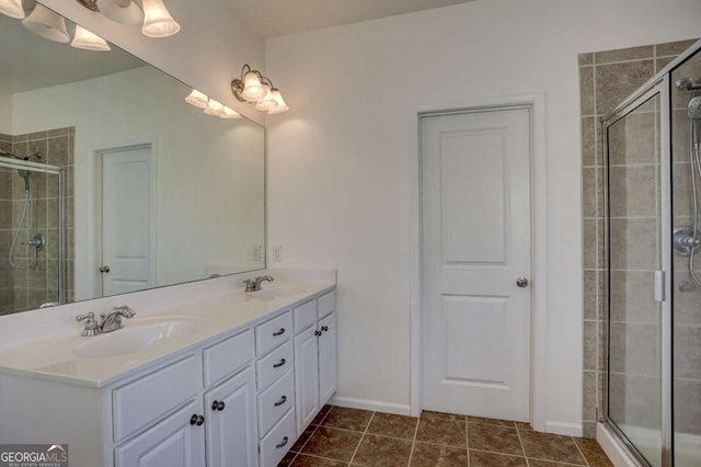 bathroom featuring vanity, an enclosed shower, and tile patterned flooring