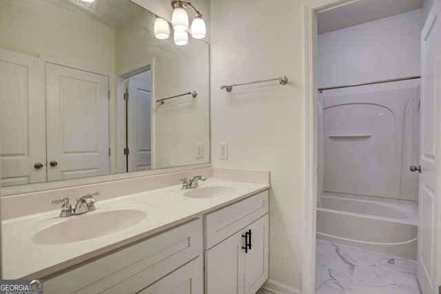 bathroom with shower / washtub combination and vanity